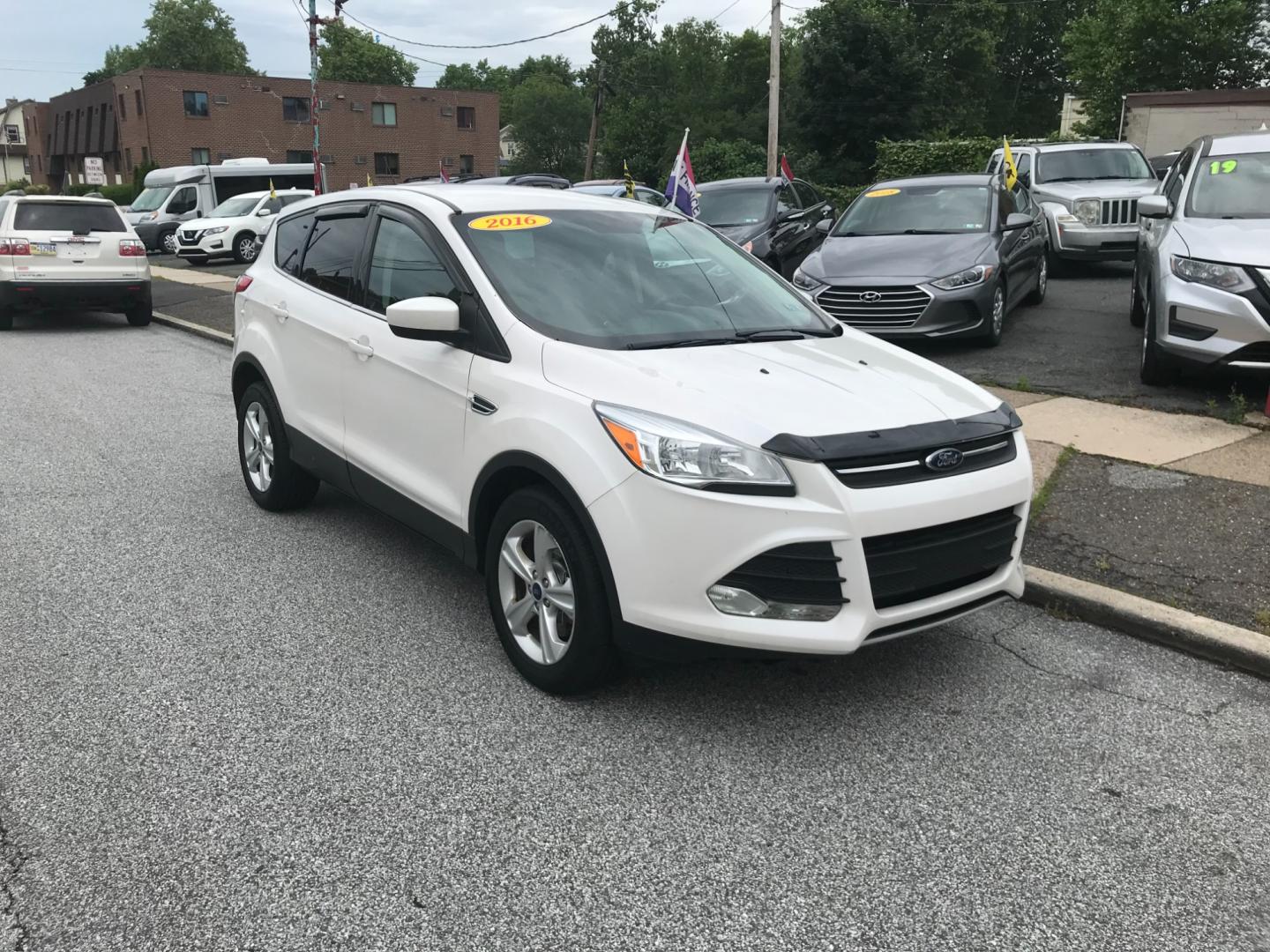 2016 White /Gray Ford Escape SE (1FMCU9GX9GU) with an 1.6 V4 engine, Automatic transmission, located at 577 Chester Pike, Prospect Park, PA, 19076, (610) 237-1015, 39.886154, -75.302338 - 2016 Ford Escape SE: Only 135k miles, 4x4, SUPER CLEAN, runs LIKE NEW! This vehicle comes inspected and has been given a bumper to bumper safety check. It is very clean, reliable, and well maintained. We offer a unique pay plan that is known for being the easiest and fastest financing option in t - Photo#2